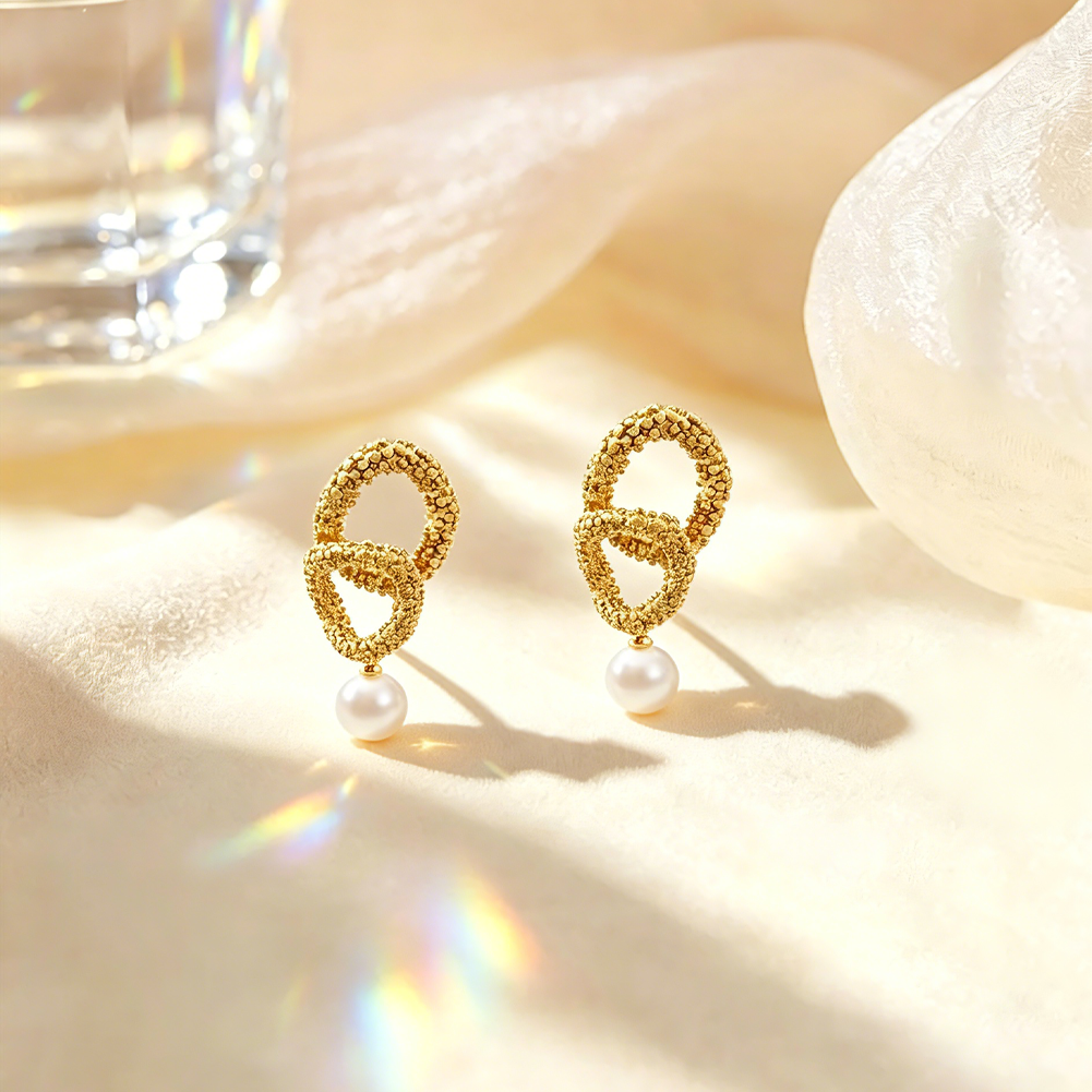 Irregular-shaped stainless steel stud earrings with pearl inlays