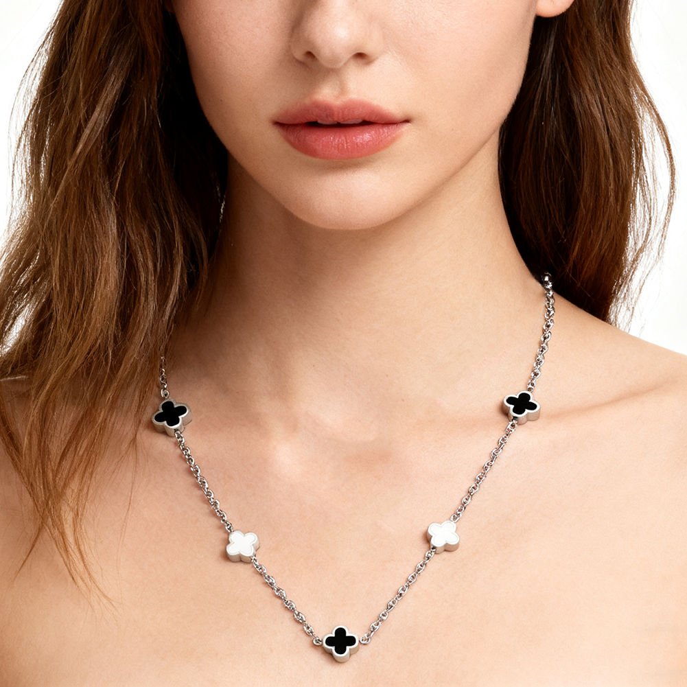 White and black four-leaf clover necklace